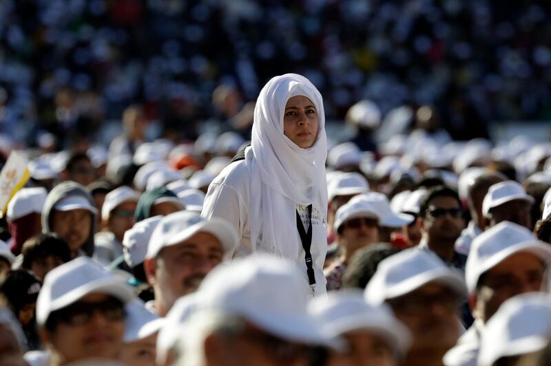 People crowd the Zayed Sports City Stadium as they wait for the arrival of Pope Francis.  AP