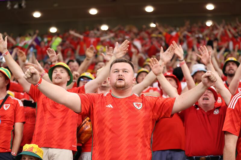 Delighted Wales fans at Ahmad bin Ali Stadium in Doha. Getty Images