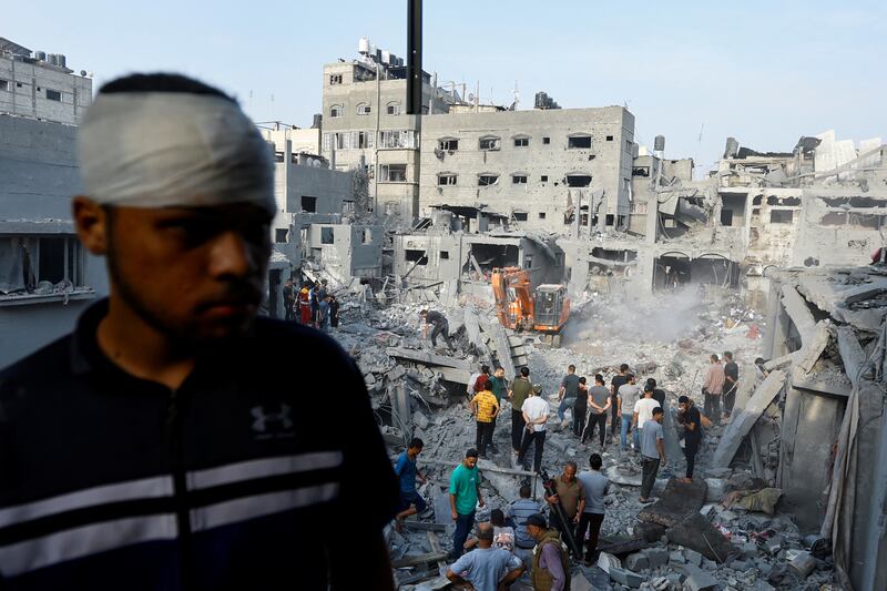 Palestinians search for casualties after Israeli attacks on houses in Khan Younis in the southern Gaza Strip. Reuters