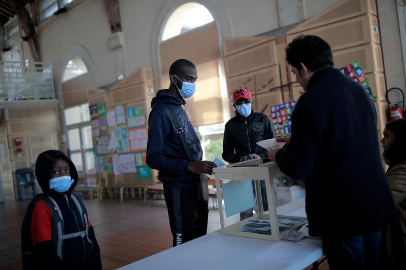 A man votes in Saint-Denis, outside Paris. AP