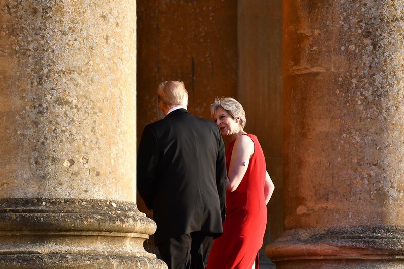 Theresa May and Donald Trump enter Blenheim Palace for a dinner hosted by the British prime minister on the first day of the US president's visit to Britain. Getty Images