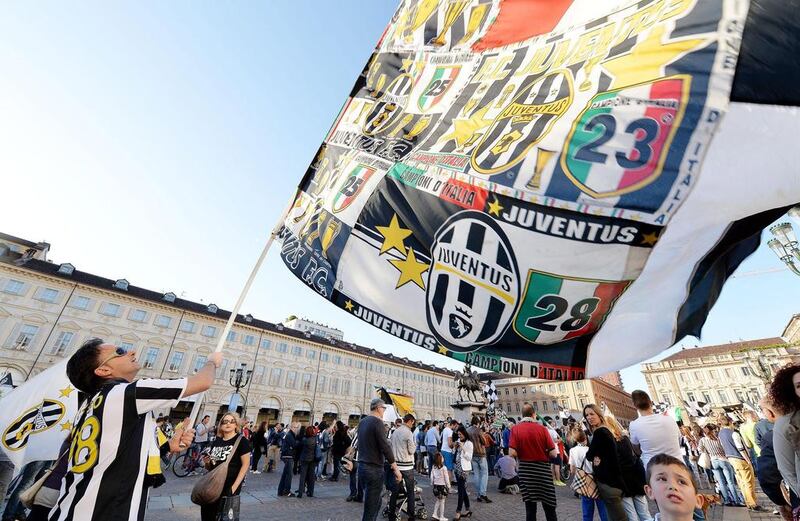 Juventus supporters celebrate the club's 30th Serie A title 'scudetto' in Piazza San Carlo on Sunday. Alessandro Di Marco / EPA / May 4, 2014