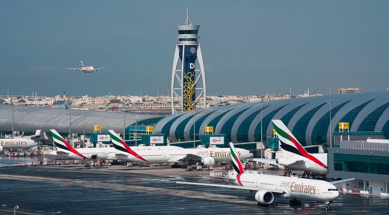 CORRECTS TO SAY THAT EMIRATES HAS DRAMATICALLY CUT ITS PASSENGER FLIGHT DESTINATIONS AND NOT SUSPENDED ALL FLIGHTS. -- FILE - In this Dec. 11, 2019 file photo, an Emirates jetliner comes in for landing at Dubai International Airport in Dubai, United Arab Emirates. On Sunday, March 22, 2020, long-haul carrier Emirates it has dramatically cut its passenger flight destinations from 145 locations to just 13 countries. (AP Photo/Jon Gambrell, File)