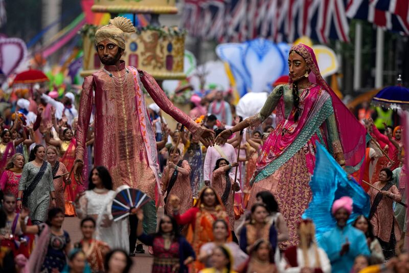 People take part in a parade during the pageant. Getty 