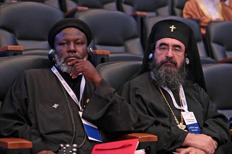 Representatives of different faiths attend the conference. AFP