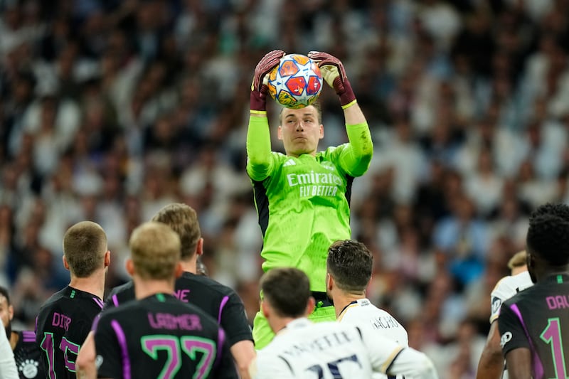 REAL MADRID RATINGS: Kept place despite Courtois’ return and reacted well to tip Kane volley wide for corner that might have crept in. Saved shot low down at his near post from same player after break and turned a Musiala strike over bar for corner. AP