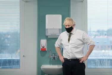 Prime Minister Boris Johnson during a visit to view the vaccination programme at Chase Farm Hospital. Getty Images