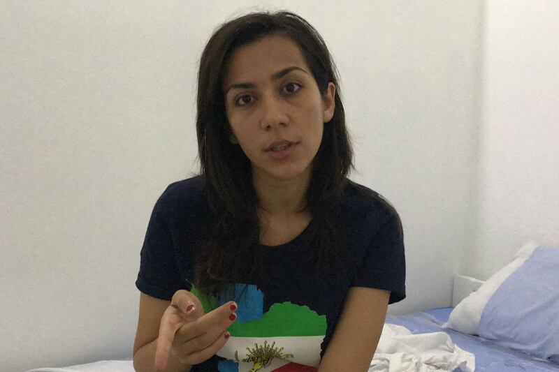 This photo taken on October 28, 2019 shows Iranian national Bahareh Zare Bahari, who sought refugee status after she was denied entry into the Philippines on October 18, speaking in her day room while holed up at the Ninoy Aquino International Airport terminal building in Manila.  An Iranian beauty queen sought by Tehran on criminal charges has been granted political asylum in the Philippines, a Filipino official said on November 8, ending a near-three-week standoff at Manila airport.
 / AFP / STR
