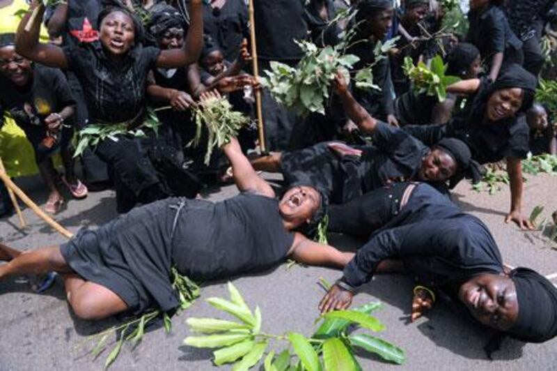 Women carrying branches of mango trees as a symbol of solidarity stage a protest in Abuja on March 11 against sectarian killings.