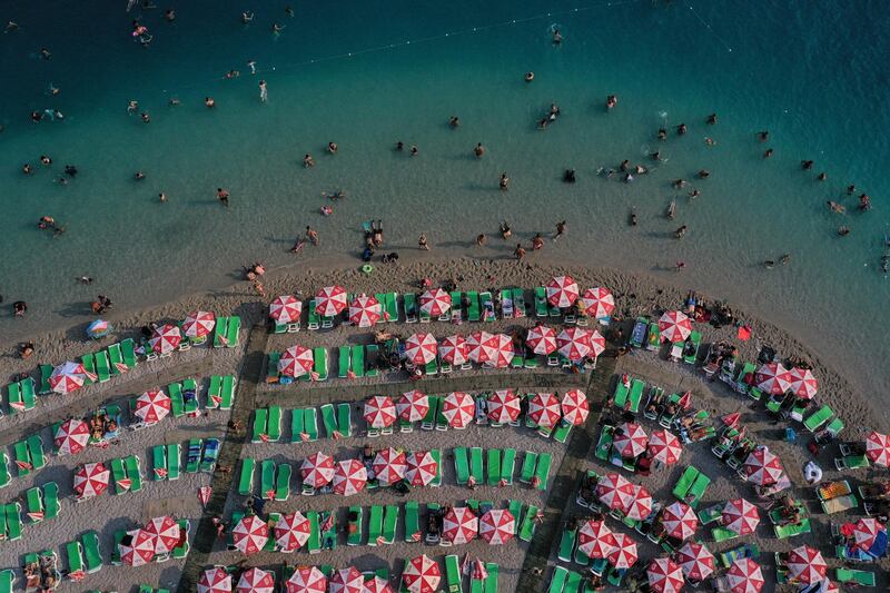 People enjoy the beach in Oludeniz, Turkey. Getty Images