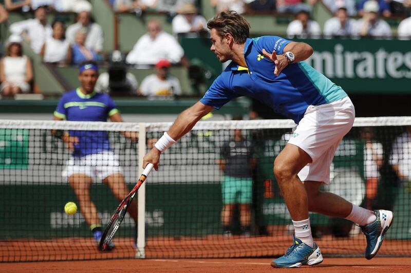 Stan Wawrinka plays a shot against Rafael Nadal. AP Photo