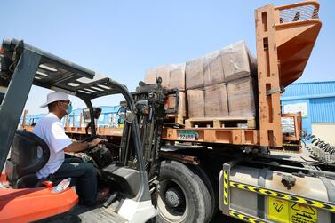 Dubai, United Arab Emirates - Reporter: Kelly Clarke. Aid is loaded onto a truck by the International Federation of Red Cross and Red Crescent Societies to support Beirut. Wednesday, August 5th, 2020. Dubai. Chris Whiteoak / The National