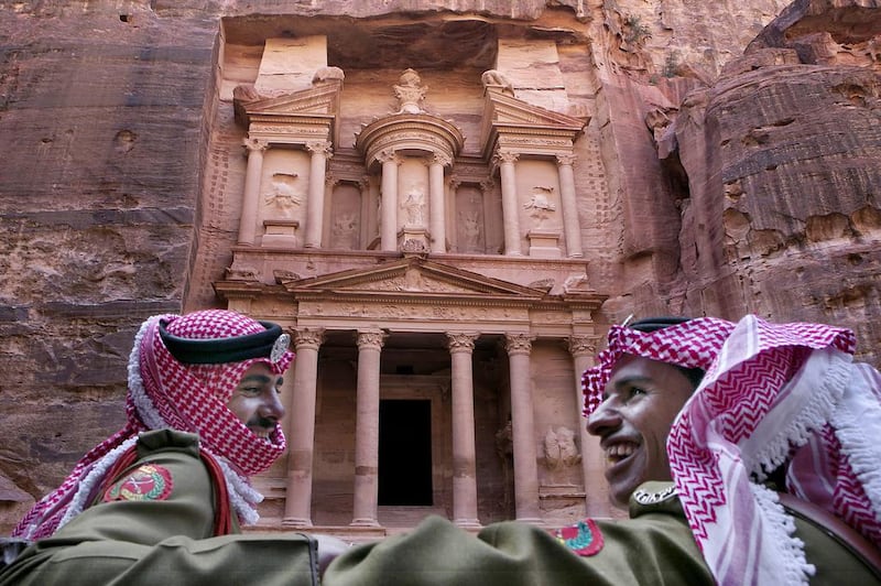 Jordanian royal desert forces stand guard in front of Al Khazneh, Arabic for the Treasury in the ancient city of Petra, Jordan. Tourism in Petra has taken a hit no thanks to regional turbulence and Jordan's high-profile role in the battle against ISIL. Raad Adayleh/AP Photo