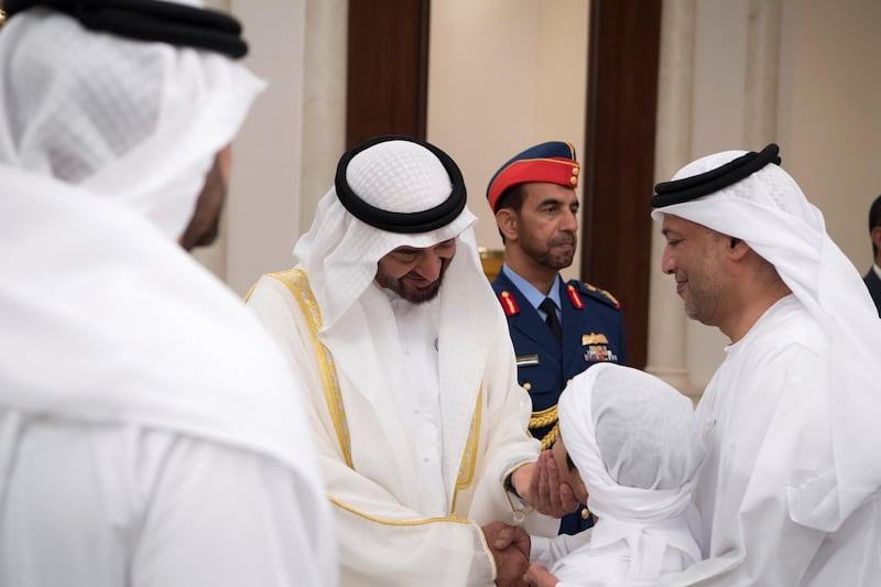 ABU DHABI, UNITED ARAB EMIRATES - June 15, 2018: HH Sheikh Mohamed bin Zayed Al Nahyan Crown Prince of Abu Dhabi Deputy Supreme Commander of the UAE Armed Forces (C), greets a young guest during an Eid Al Fitr reception at Mushrif Palace. 

( Saeed Al Neyadi / Crown Prince Court - Abu Dhabi )
---