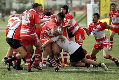 Dubai, April 13, 2018: Sharjah Wanderers ( Grey) and Dubai Tigers ( Red) in action during the UAE Conference finals match at the Rugby Park in Dubai. Satish Kumar for the National / Story by Paul Radley