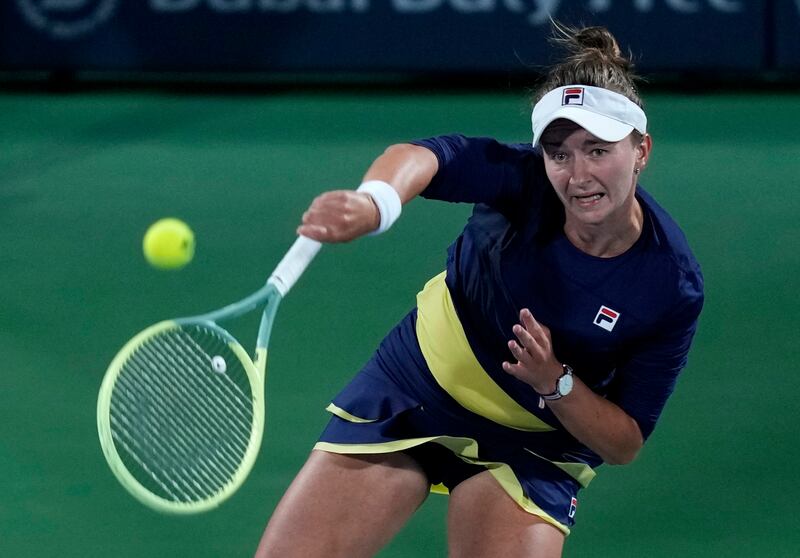 Czech Republic's Barbora Krejcikova returns the ball to Poland's Iga Swiatek. AP