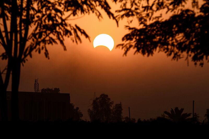 This picture taken early shows a view of the sun in the central Iraqi holy shrine city of Najaf during the partial solar eclipse event.  AFP