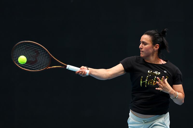 Ons Jabeur plays a forehand during a practice session at Melbourne Park. Getty