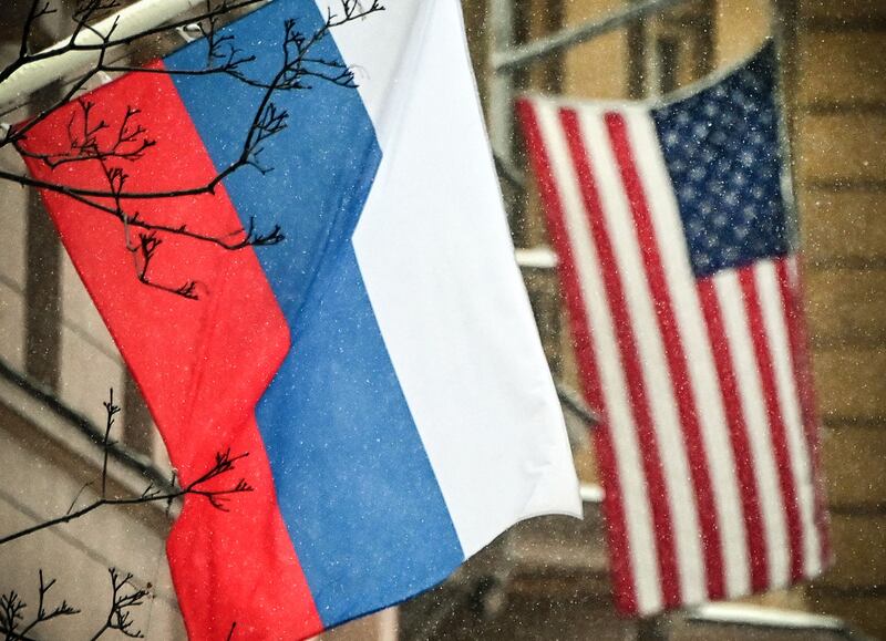 Russian and US flags fly next to the US embassy building in Moscow. AFP