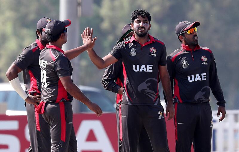 ABU DHABI , UNITED ARAB EMIRATES , October 24  – 2019 :- Junaid Siddique of UAE ( center ) celebrating after taking the wicket of Sulaimon Runsewe  during the World Cup T20 Qualifiers between UAE vs Nigeria held at Tolerance Oval cricket ground in Abu Dhabi. UAE won the match by 5 wickets.  ( Pawan Singh / The National )  For Sports. Story by Paul