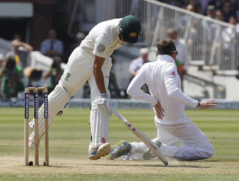 Australia's Usman Khawaja (L) collides with England's Graeme Swann whilst running between wickets during play on the fourth day of the second Ashes cricket test match between England and Australia at Lord's cricket ground in north London, on July 21, 2013. AFP PHOTO / IAN KINGTON

RESTRICTED TO EDITORIAL USE. NO ASSOCIATION WITH DIRECT COMPETITOR OF SPONSOR, PARTNER, OR SUPPLIER OF THE ECB
 *** Local Caption ***  588594-01-08.jpg