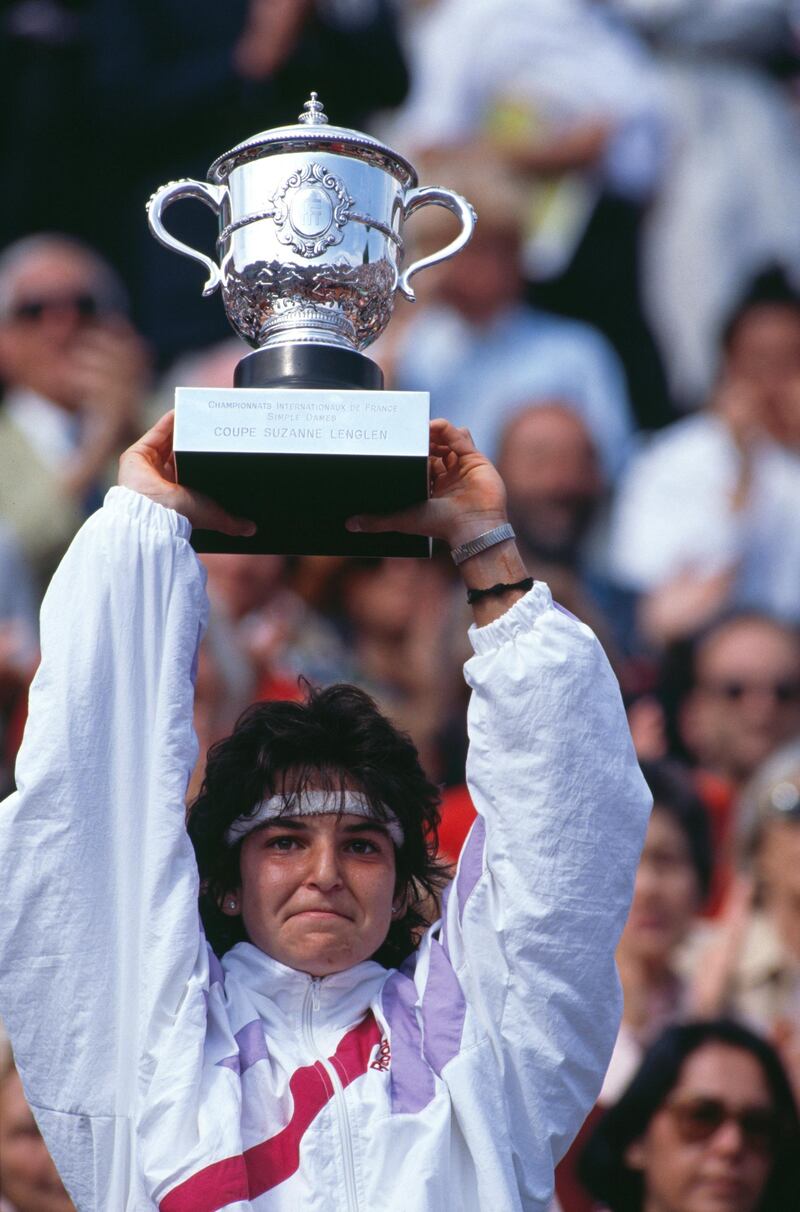 Arantxa Sanchez Vicario of Spain holds aloft the Suzanne Lenglen trophy after winning the Women's Singles Final match against Steffi Graf at the French Open Tennis Championship on 10 June 1989 at the Stade Roland Garros Stadium in Paris, France. (Photo by Simon Bruty/Getty Images)