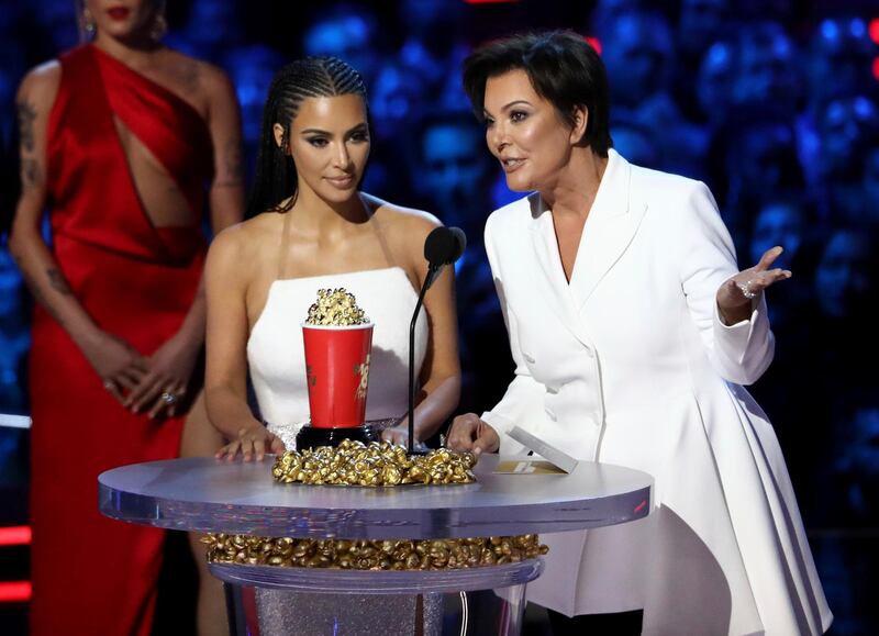 Kim Kardashian West, left, and Kris Jenner accept the best reality series award for 'Keeping Up With The Kardashians' AP
