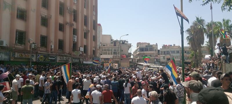 Young Druze men cut off some roads during the protests. Photo: Suwayda24
