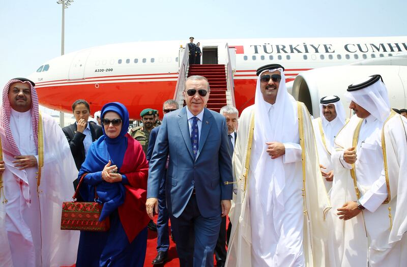 Turkish President Tayyip Erdogan, accompanied by his wife Emine Erdogan, is welcomed by Emir of Qatar Sheikh Tamim Bin Hamad Al-Thani in Doha, Qatar, July 24, 2017. Kayhan Ozer/Presidential Palace (Turkey)/Handout via REUTERS ATTENTION EDITORS - THIS IMAGE HAS BEEN SUPPLIED BY A THIRD PARTY. NO RESALES. NO ARCHIVES