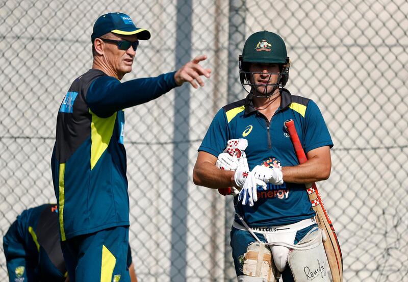 Australian batting coach Graeme Hick speaks with Joe Burns. Getty