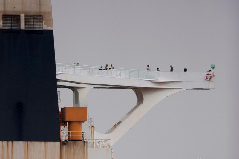 Crew members walk on board supertanker Grace 1 off the coast of Gibraltar.  AFP