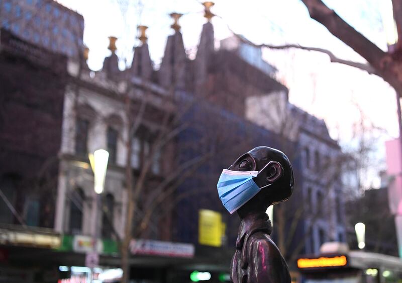 A statue wearing a face mask is seen in Melbourne, Australia.  Getty Images