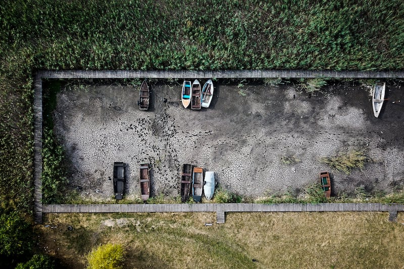 Boats lie on a dry lake bed in a port in Velence, Hungary, as a huge drought sweeps across Europe. AP Photo