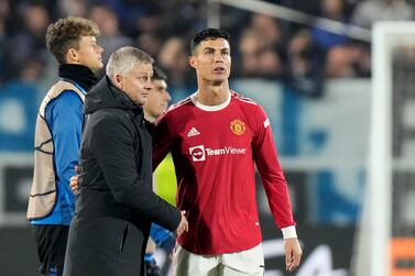 Manchester United's manager Ole Gunnar Solskjaer approaches Manchester United's Cristiano Ronaldo at the end of the Champions League group F soccer match between Atalanta and Manchester United, at the Stadio di Bergamo, in Bergamo, Italy, Tuesday, Nov.  2, 2021.  The game ended in a 2-2 draw.  (AP Photo / Luca Bruno)