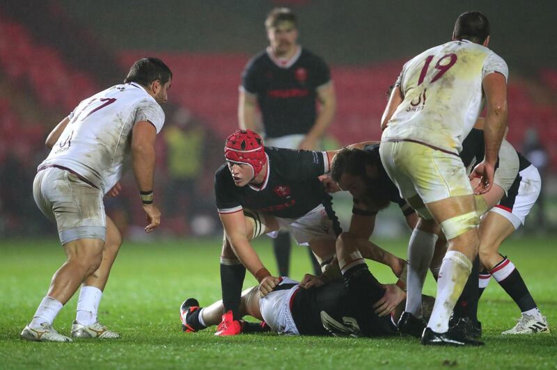 Wales' James Botham, centre, during the Autumn Nations Cup match at Parc y Scarlets, Llanelli. PA