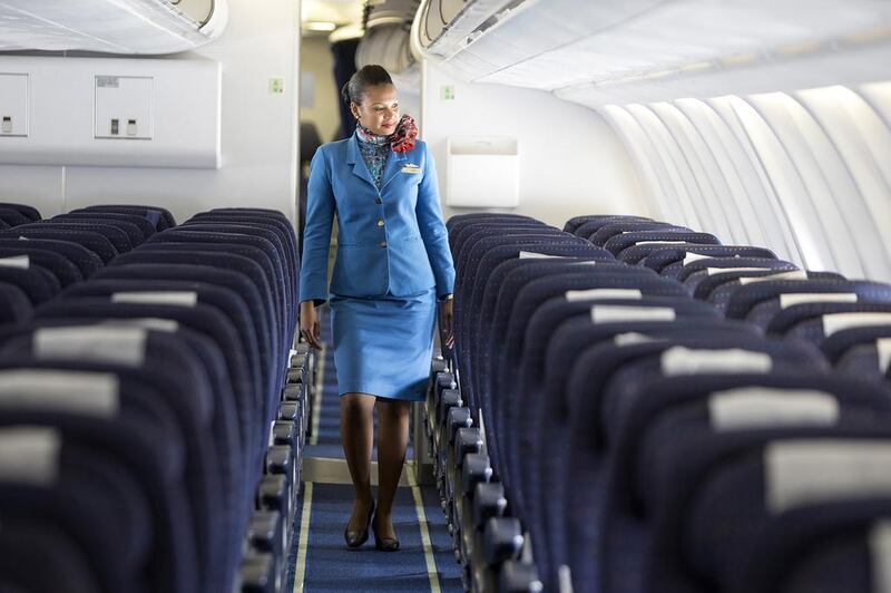 A flight attendant demonstrates the Air Seychelles’ onboard service for the airline’s business class. Silvia Razgova / The National