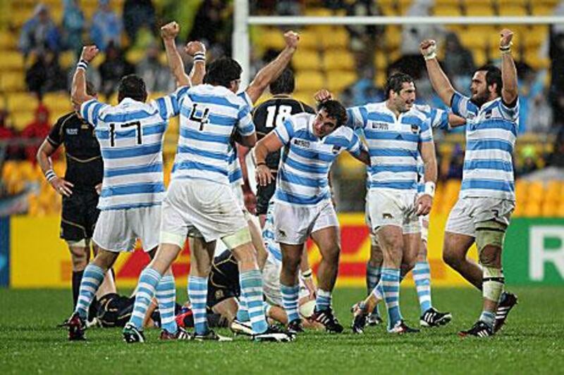 Argentina players celebrate at full time after narrowly beating Scotland 13-12 in Pool B of the Rugby World Cup which boosts their chances of reaching the last-eight.