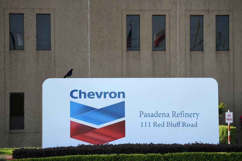 FILE PHOTO: An entrance sign at the Chevron refinery, located near the Houston Ship Channel, is seen in Pasadena, Texas, U.S., May 5, 2019.  REUTERS/Loren Elliott/File Photo