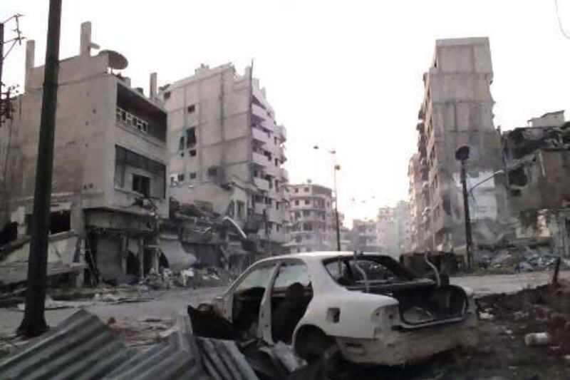 A damaged car in the Al Khalidiya neighbourhood of Homs. As the Syrian conflict continues, local city councils have taken on more of the responsibilities of running districts.