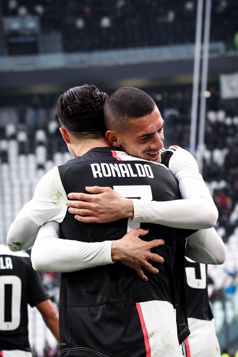 Juventus forward Cristiano Ronaldo (7) celebrates with Juventus defender Merih Demiral (28) after scoring his goal to make it 1-0 during the Serie A football match n.16 JUVENTUS - UDINESE on December 15, 2019 at the Allianz Stadium in Turin, Piedmont, Italy. (Photo by Matteo Bottanelli/NurPhoto via Getty Images)