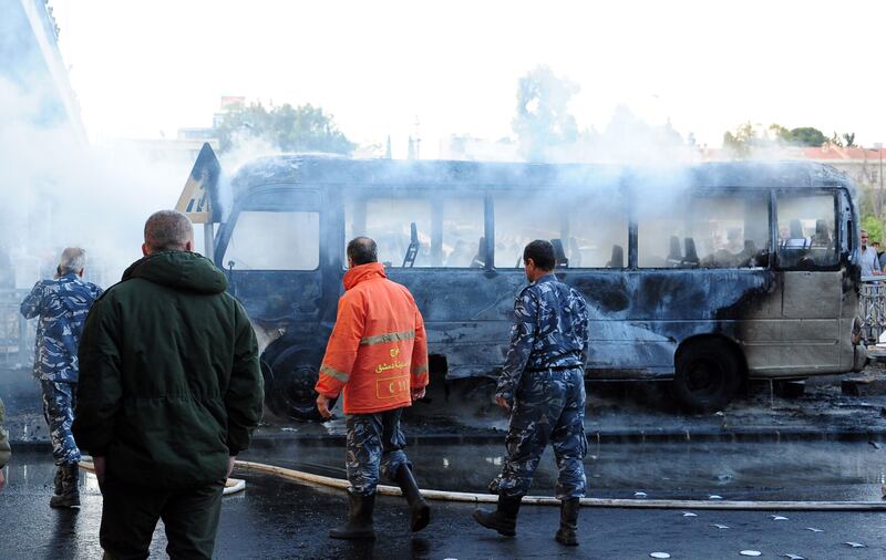 Two roadside bombs exploded near a bus carrying troops in early morning of October 20 near Al Tanf base, which is used by US troops. At least 14 people were killed and three others wounded, according to a state TV report.   EPA / Syrian Arab News Agency