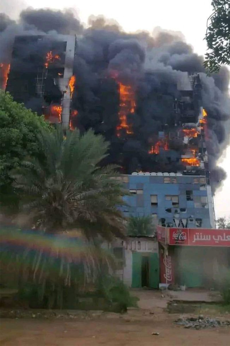 It was not clear how the buildings in Khartoum caught fire, but the fighting over a nearby armed forces' headquarters involved artillery and air strikes
