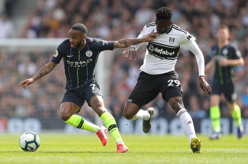 Raheem Sterling of Manchester City is challenged by Andre-Frank Zambo Anguissa of Fulham. Getty Images