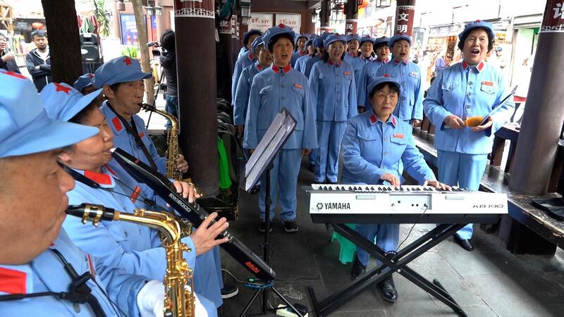 Retirees gather to sing Red Army revolutionary songs, in Zunyi, in southwestern China's Guizhou province. AP