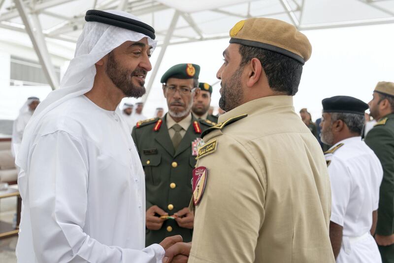 ABU DHABI, UNITED ARAB EMIRATES - April 23, 2018: HH Sheikh Mohamed bin Zayed Al Nahyan Crown Prince of Abu Dhabi Deputy Supreme Commander of the UAE Armed Forces (L), awards a member of the UAE Armed Forces with a Medal of Bravery for his service in Yemen, during a Sea Palace barza.

( Rashed Al Mansoori / Crown Prince Court - Abu Dhabi )