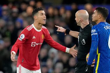 Manchester United's Cristiano Ronaldo talks to Referee Anthony Taylor while Chelsea's Thiago Silva, right, looks on during the English Premier League soccer match between Chelsea and Manchester United at Stamford Bridge stadium in London, Sunday, Nov.  28, 2021.  (AP Photo / Kirsty Wigglesworth)