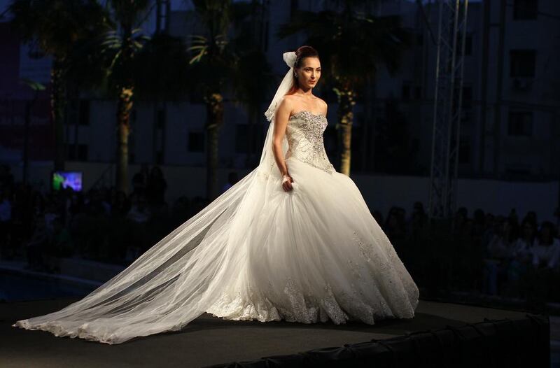 A model displays a stunning wedding dress. AFP