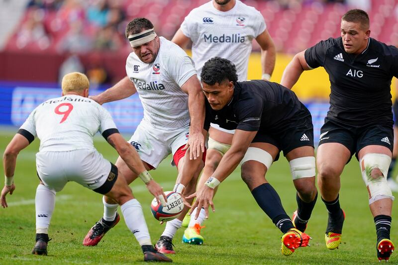 New Zealand's Tupou Vaa'i competes for the ball with United States' Paul Mullen, second left. AP Photo