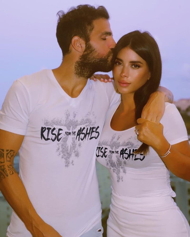 Spanish footballer Cesc Fabregas and Lebanese model Daniella Semaan Fabregas wearing Zuhair Murad's Rise from the Ashes T-shirt. Instagram / cescf4bregas