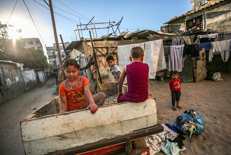 Palestinian refugees children play outside their family house in the streets of Khan Younis refugee camp in southern Gaza Strip . World Refugee Day is marked on 20 June each year to highlight the suffering of the tens of millions of people forced to flee their homes due to war or persecution. Nearly one-third of the registered Palestine refugees, more than 1.5 million individuals, live in 58 recognized Palestine refugee camps in Jordan, Lebanon, the Syrian Arab Republic, the Gaza Strip and the West Bank, including East Jerusalem.  EPA